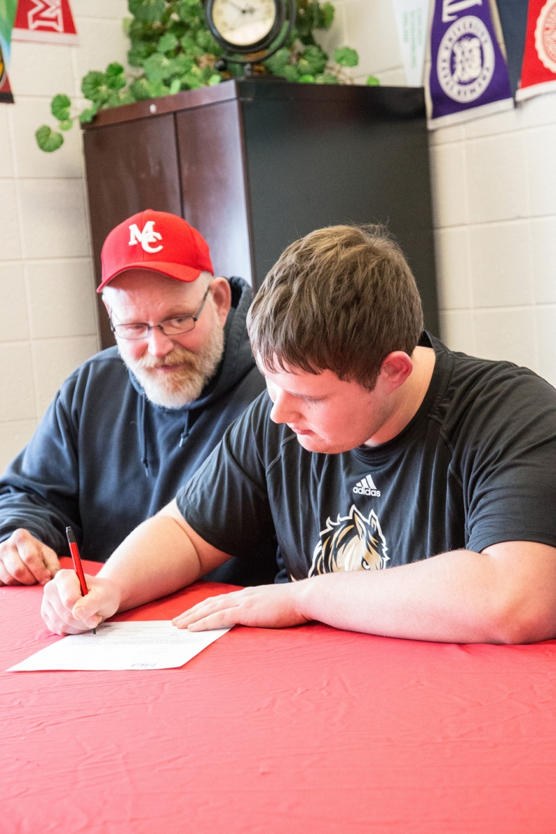 Marian football players sign with college programs - The Woodstock