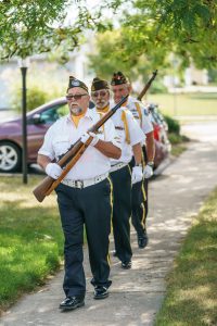 greg walkington commander, ed chambers, fred strauss, and john widmayer in the rear with a rifle
