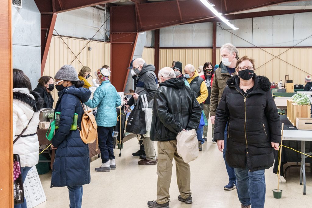 shoppers lined up to purchase meat