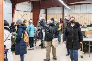 shoppers lined up to purchase meat