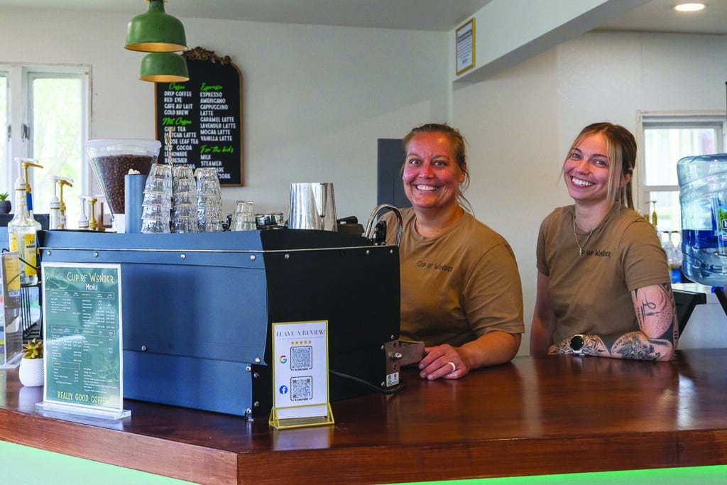 Cup of Wonder owner Sarah Dycus and assistant manager Linnea Oien serve customers from behind the counter.








independent photo by 
Andrew Rousey

