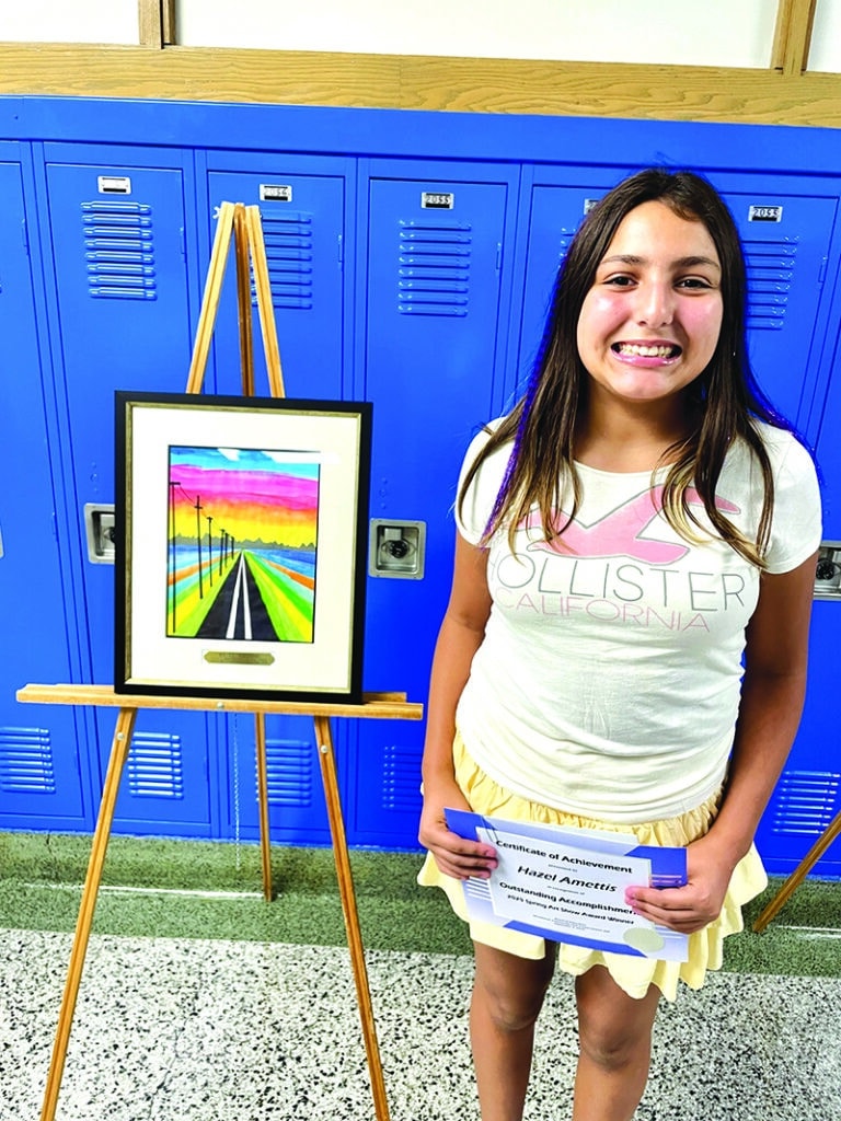 District 200 Photos
Hazel Ammettis, a fifth-grader at Dean Street Elementary School, poses with her winning artwork, from the Spring 2025 Art Show, during the District 200 Board of Education meeting last week.