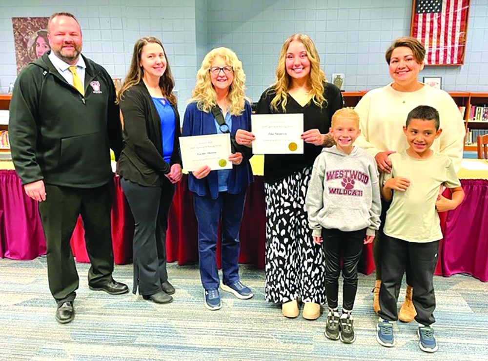 Courtesy photo.
During staff recognition at the Oct. 28 D200 Board of Education meeting, Westwood Elementary School staff members were honored for exceptional efforts in their jobs. Pictured, (from left) are Westwood Elementary School Principal Ryan Hart; Dr. Heather Leon; social worker Kristin Throw; classroom associate Lily Swanson; second-grade student Shelby O'Brien; Maria Perez; and second-grade student Nikolas Prado.