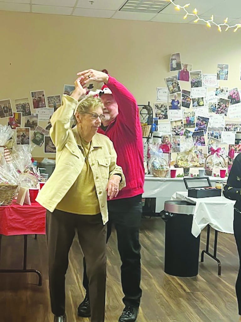 Courtesy photo.
Nancy Schiller and Roger Mickelson dance to the Christmas music at the SOAR@Dorr holiday party.
