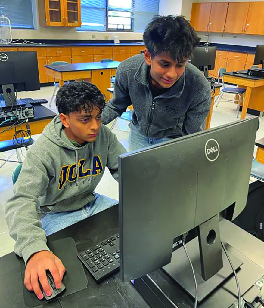 Courtesy  photo.
Seniors Eshaan Virani and Krishna Patel work on their award-winning app at Woodstock High School