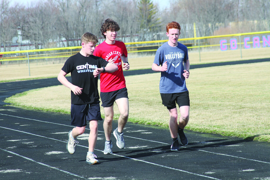 Independent photo by Steve Peterson.
Marian Central runners (from left) Zach Wheadon, Gavin Barry, and Nathan Convey work out at a recent Hurricanes practice.
