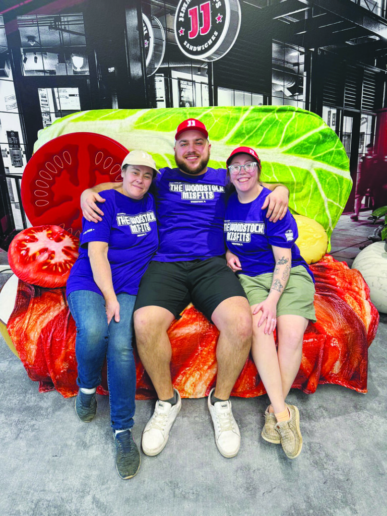Courtesy photo.
The Woodstock Misfits-Amy Ligman, Jacob Waryck, and Erin Fritz-relax on a sandwich couch during Jimmy John's team competition in Atlanta in February.