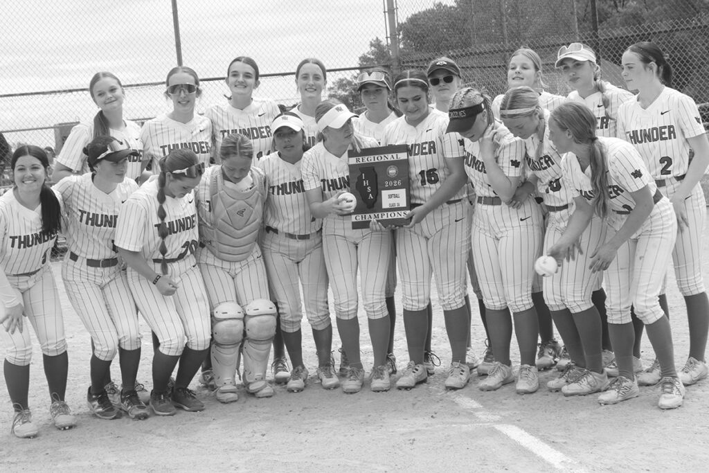 Independent photo by Steve Peterson.
The Woodstock North's softball team celebrates its regional softball title.